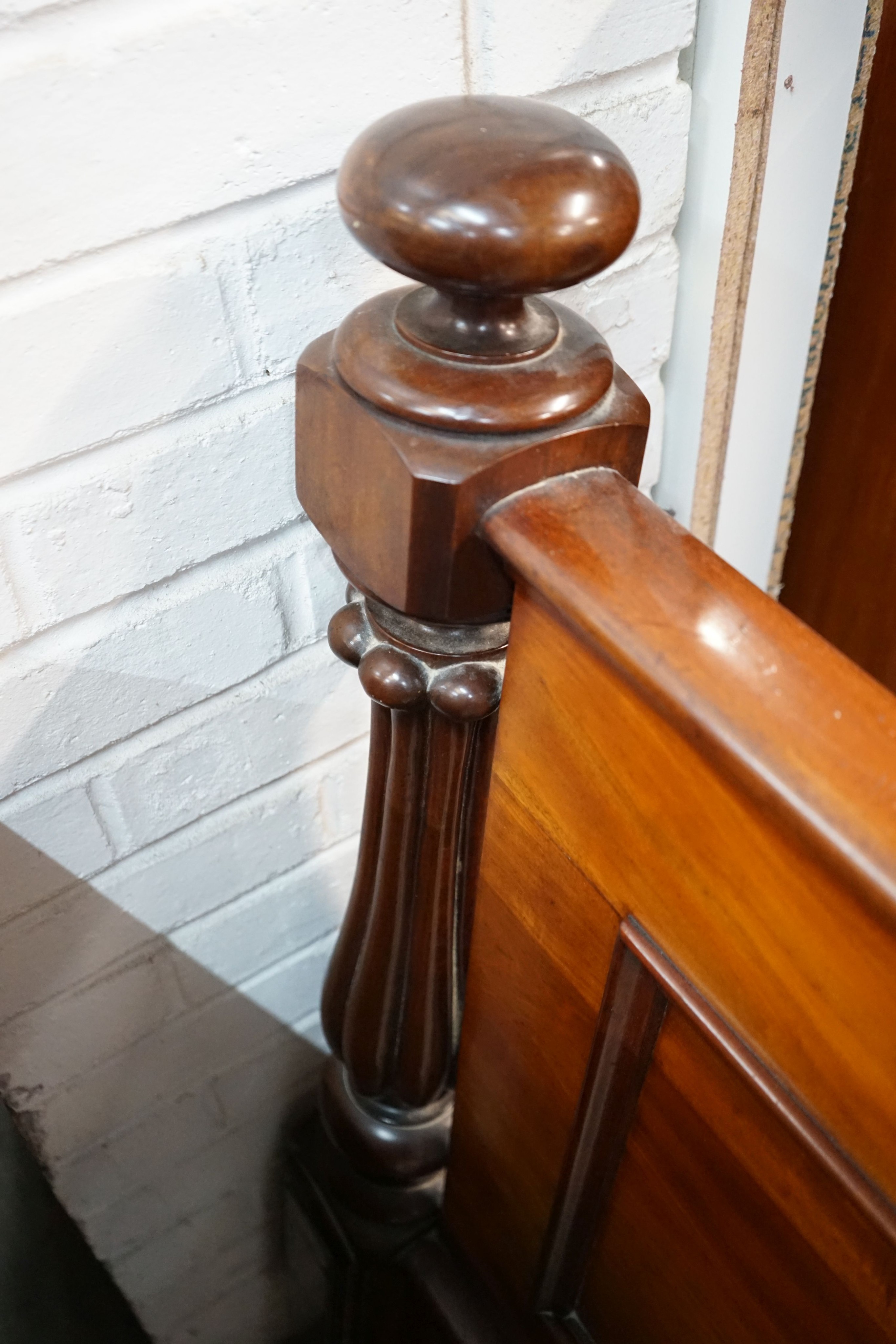 A Victorian mahogany footboard, width 154cm, height 106cm